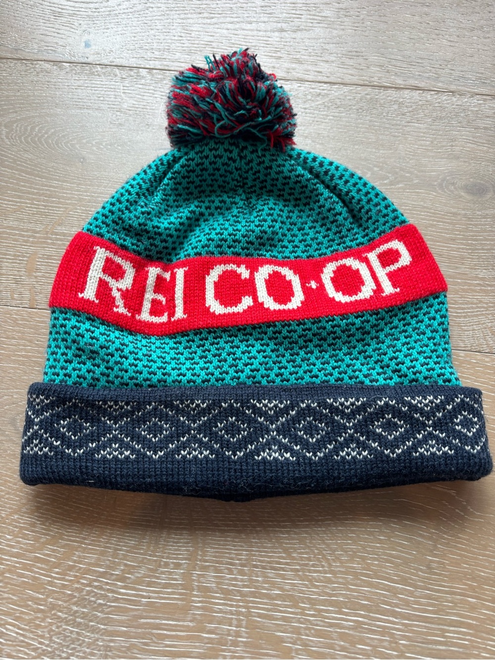REI Teal Beanie with Red Logo Band and Navy Cuff